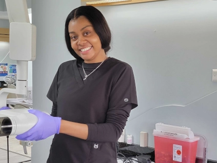 dental assistant student training with x-ray equipment